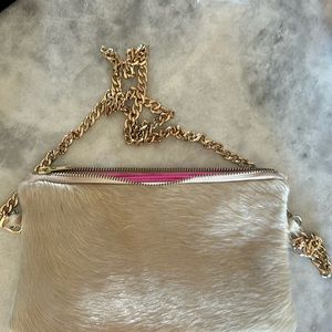 Parker and Hyde purse with pink lining.